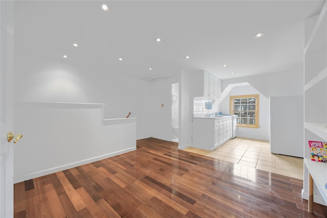 bonus room featuring light wood-style floors, vaulted ceiling, and recessed lighting