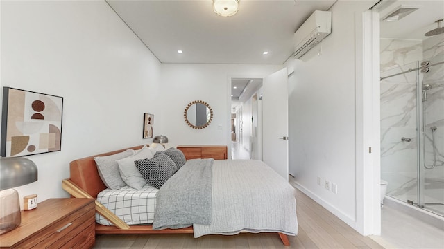 1043 Halsey St Unit 4, Brooklyn, NY 11207 - bedroom with recessed lighting, light wood-style floors, ensuite bath, and a wall mounted air conditioner