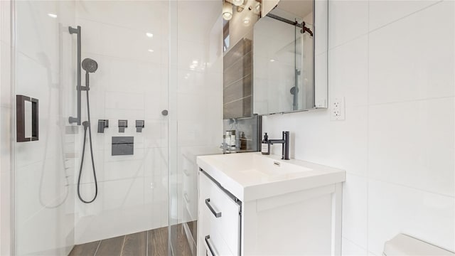 1043 Halsey St Unit 4, Brooklyn, NY 11207 - full bath featuring a tile shower, wood finished floors, and vanity