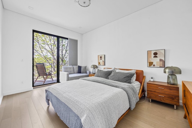 1043 Halsey St Unit 4, Brooklyn, NY 11207 - bedroom with baseboards, light wood-style flooring, and access to exterior