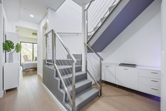 1043 Halsey St Unit 4, Brooklyn, NY 11207 - staircase with recessed lighting and wood finished floors