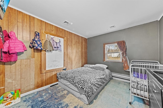 77 Jessup Switch Rd, Florida, NY 10921 - bedroom featuring wood walls, a baseboard heating unit, and baseboards