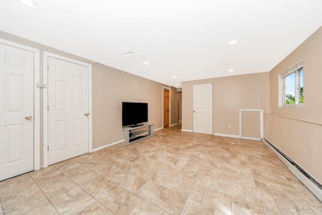 interior space featuring baseboards, recessed lighting, a baseboard heating unit, and stone finish floor