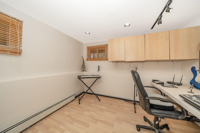 office space with recessed lighting, light wood finished floors, and baseboard heating