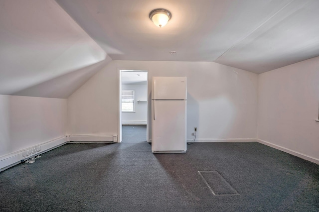 bonus room featuring dark carpet, vaulted ceiling, and baseboards