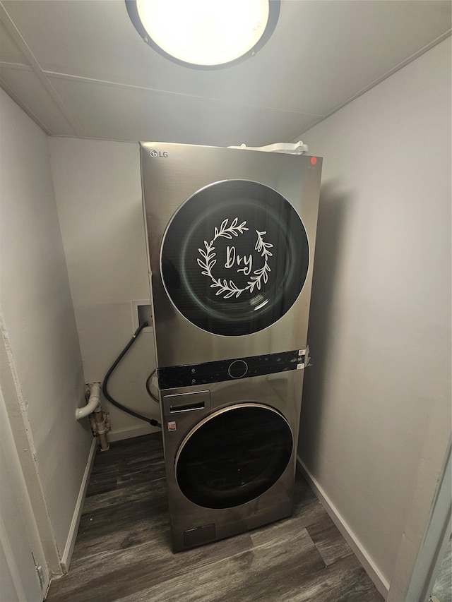 648 Lybolt Rd, Middletown, NY 10941 - washroom with baseboards, stacked washer / drying machine, wood finished floors, and laundry area