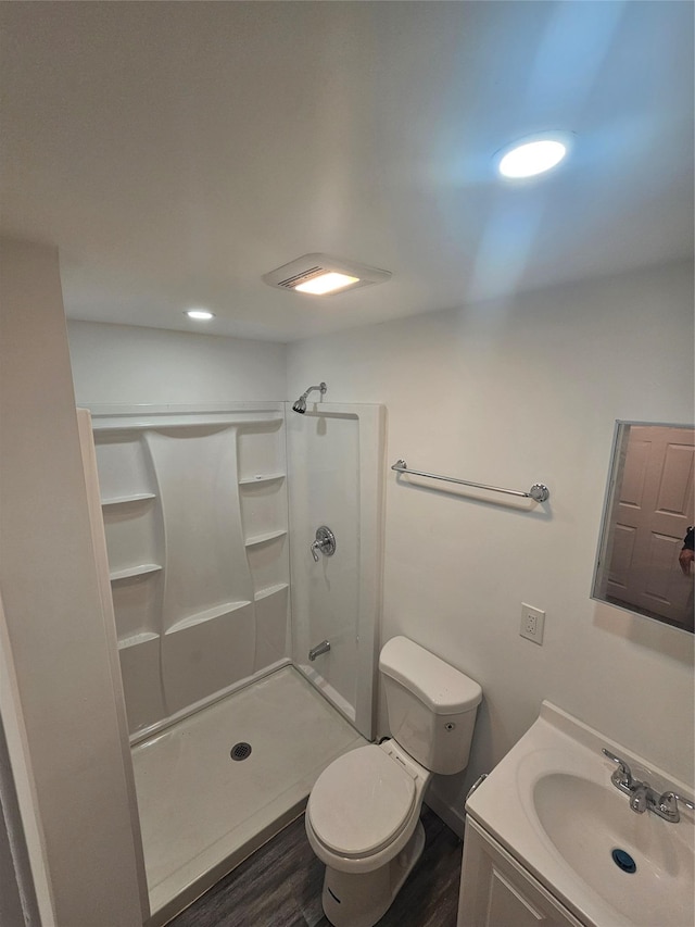 648 Lybolt Rd, Middletown, NY 10941 - bathroom with a shower stall, toilet, vanity, and wood finished floors