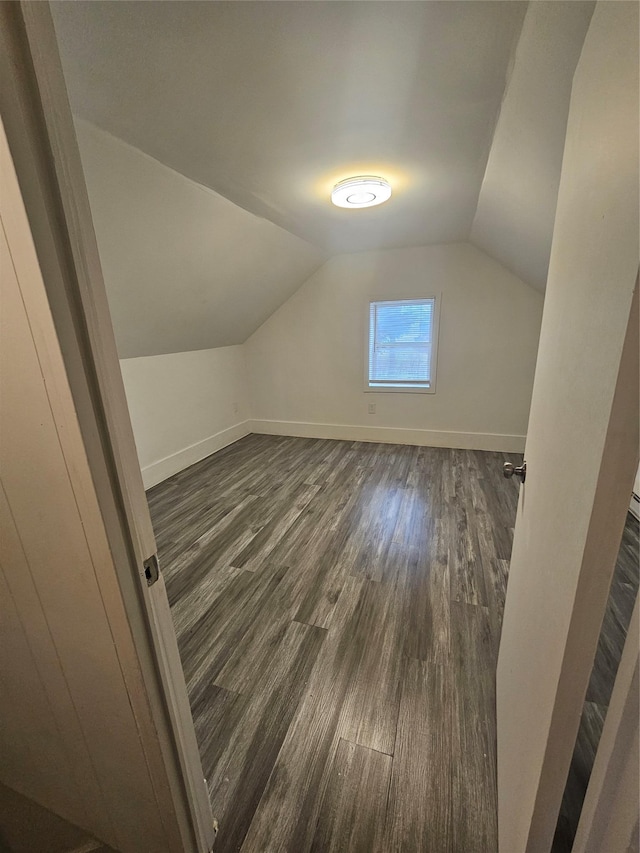 648 Lybolt Rd, Middletown, NY 10941 - bonus room with vaulted ceiling, baseboards, and dark wood finished floors