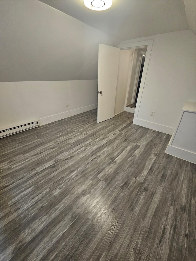 648 Lybolt Rd, Middletown, NY 10941 - additional living space with a baseboard radiator, lofted ceiling, dark wood-type flooring, and baseboards