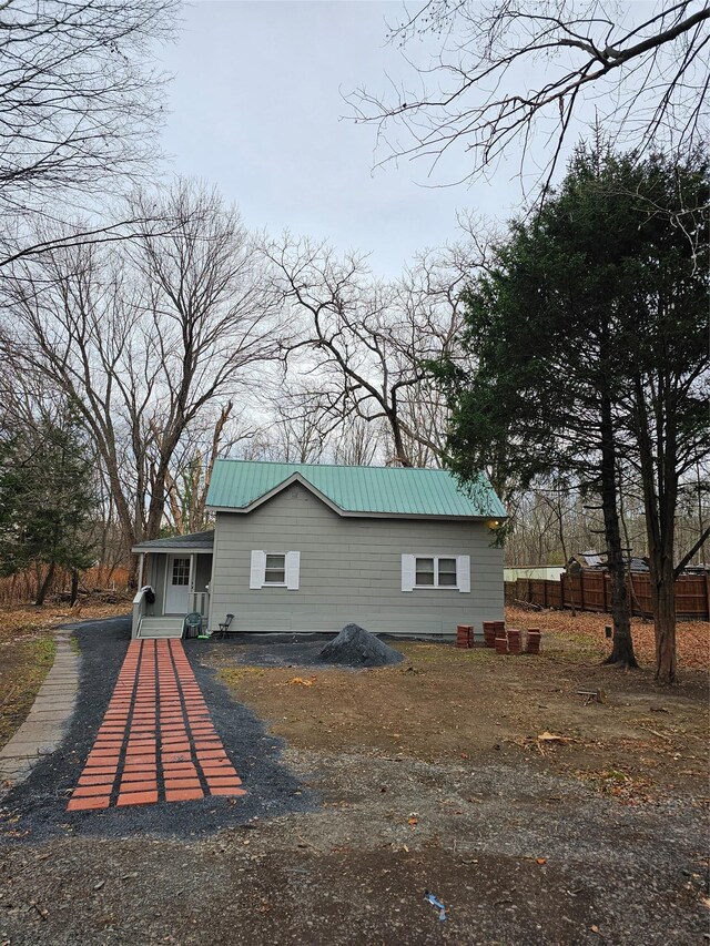 648 Lybolt Rd, Middletown, NY 10941 - rear view of property featuring aphalt driveway and metal roof