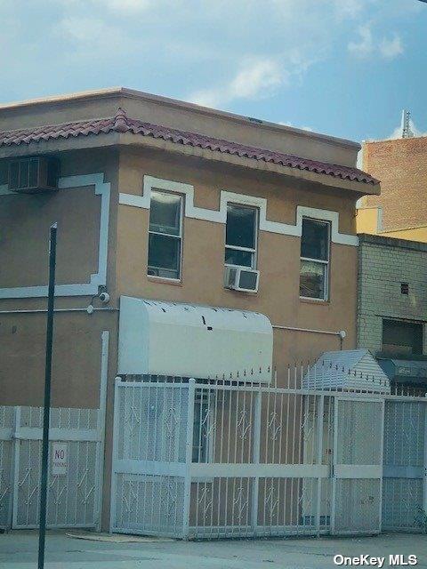 view of property exterior featuring fence, cooling unit, and stucco siding
