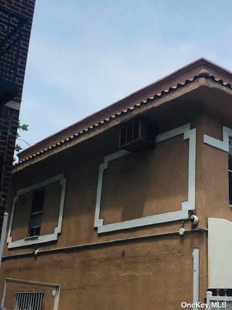 view of side of property featuring stucco siding