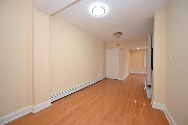 174-20 Jewel Ave, Fresh Meadows, NY 11365 - corridor featuring light wood-style floors, a baseboard radiator, and baseboards