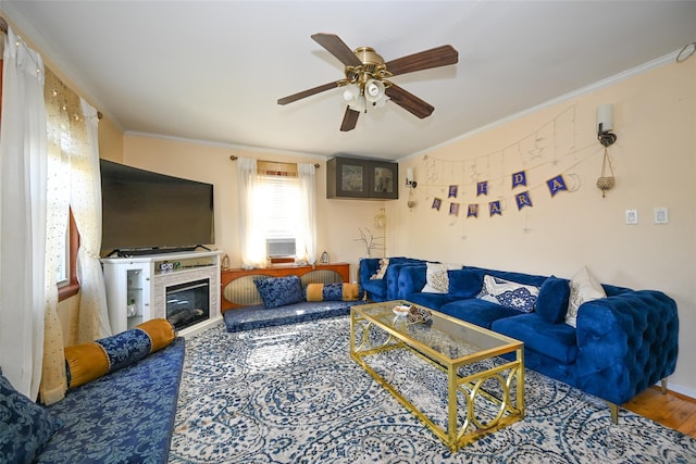 174-20 Jewel Ave, Fresh Meadows, NY 11365 - living room featuring crown molding, ceiling fan, wood finished floors, and a tile fireplace