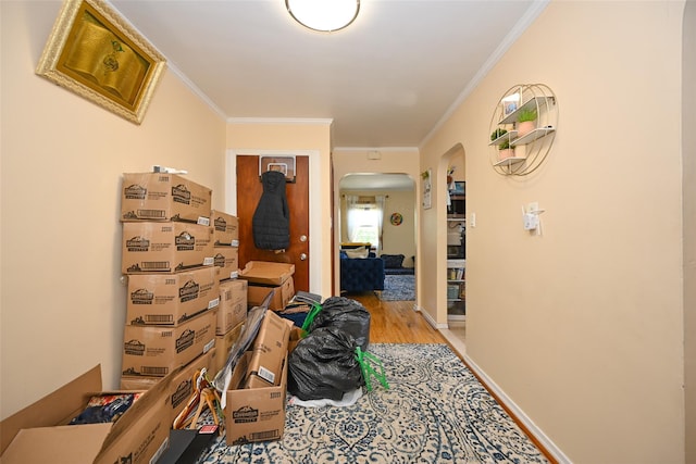 174-20 Jewel Ave, Fresh Meadows, NY 11365 - hall with arched walkways, ornamental molding, and light wood-type flooring