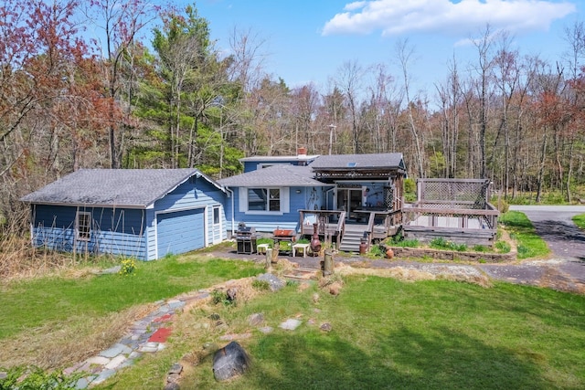 236 Lakeview Drive Rd, Eldred, NY 12743 - view of front of property with a forest view, a chimney, a front yard, a deck, and a garage