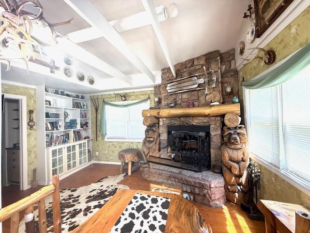 236 Lakeview Drive Rd, Eldred, NY 12743 - living area featuring baseboards, beam ceiling, a stone fireplace, and wood finished floors