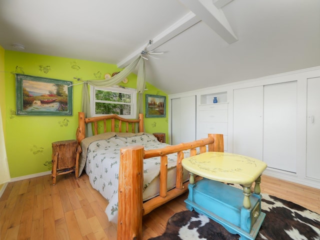 236 Lakeview Drive Rd, Eldred, NY 12743 - bedroom featuring baseboards, lofted ceiling with beams, two closets, and light wood-type flooring