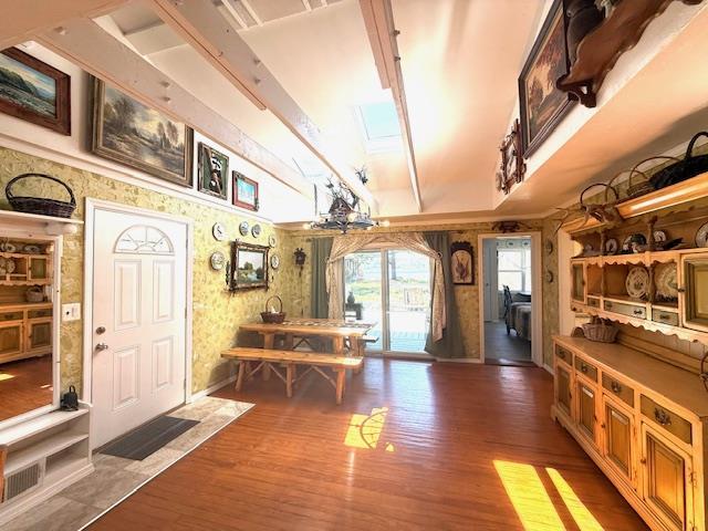 236 Lakeview Drive Rd, Eldred, NY 12743 - foyer entrance with baseboards, wallpapered walls, a skylight, and wood finished floors