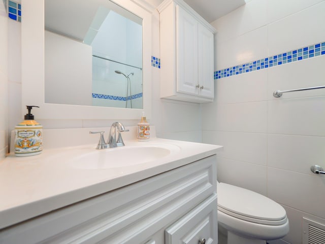236 Lakeview Drive Rd, Eldred, NY 12743 - full bathroom with visible vents, vanity, toilet, tile walls, and walk in shower