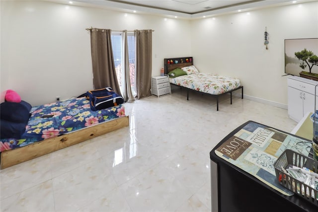 bedroom featuring baseboards