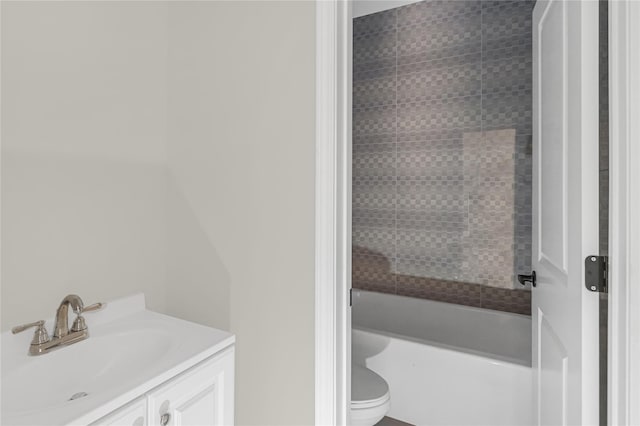 bathroom featuring toilet and vanity