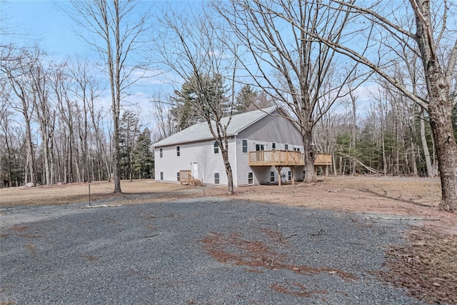 view of property exterior featuring a deck