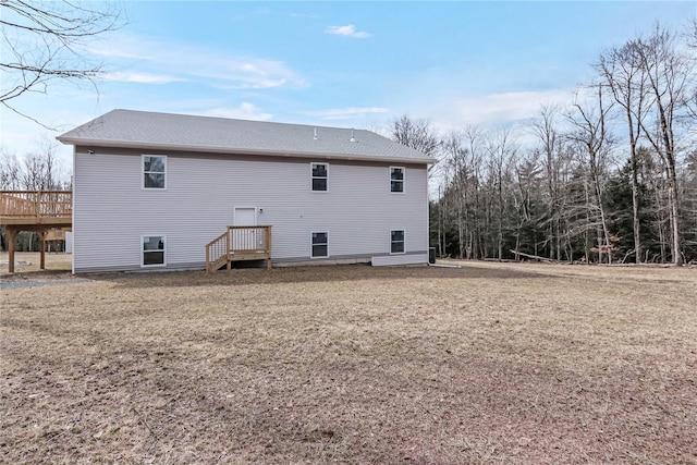 back of property featuring a wooden deck and a shingled roof