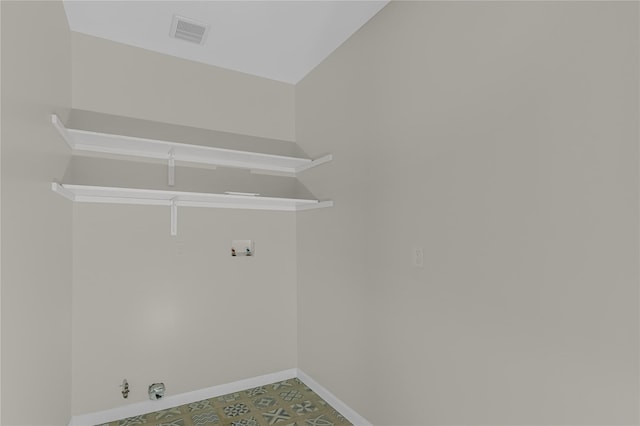 clothes washing area with washer hookup, gas dryer hookup, visible vents, baseboards, and laundry area
