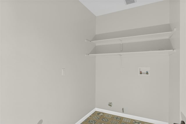 laundry room with hookup for a gas dryer, washer hookup, visible vents, and baseboards
