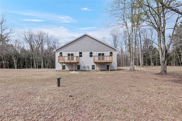 rear view of house featuring a deck