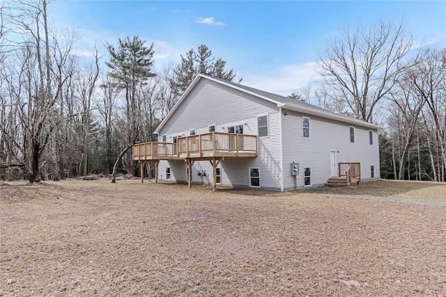 view of home's exterior with a wooden deck