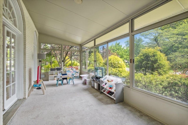 unfurnished sunroom with lofted ceiling