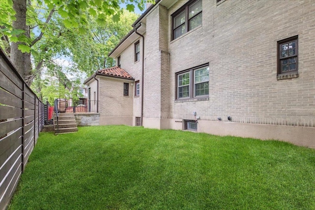 back of property featuring brick siding