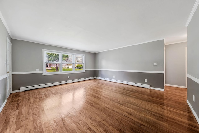 53 Abinet Ct, Selden, NY 11784 - empty room with wood finished floors, ornamental molding, a baseboard heating unit, and baseboards