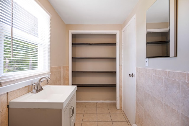 53 Abinet Ct, Selden, NY 11784 - bathroom with tile walls, tile patterned flooring, vanity, and wainscoting