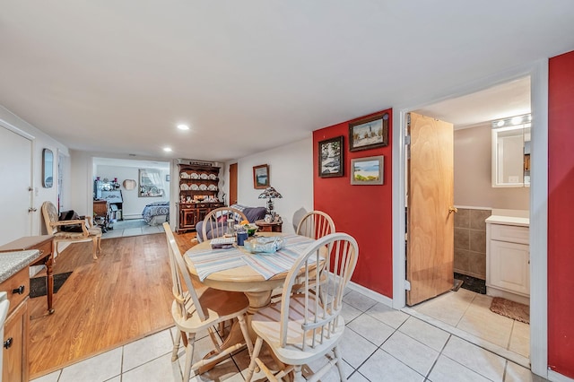 53 Abinet Ct, Selden, NY 11784 - dining space featuring light tile patterned floors and baseboards