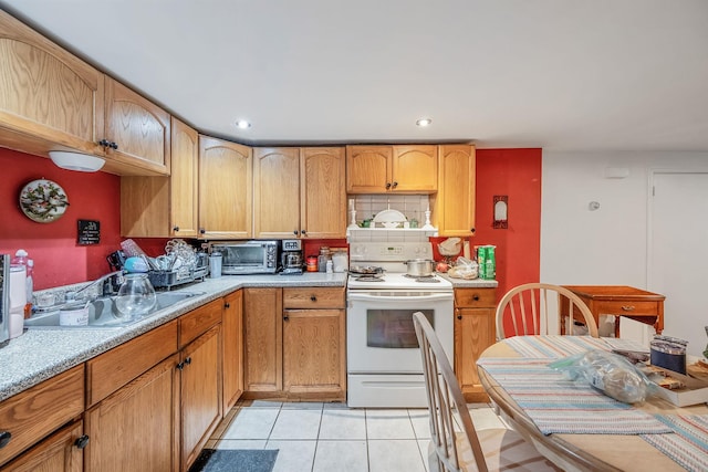 53 Abinet Ct, Selden, NY 11784 - kitchen featuring electric range, light countertops, stainless steel microwave, recessed lighting, and light tile patterned floors