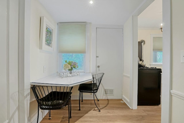 dining room featuring light wood-style flooring and plenty of natural light