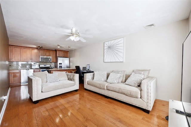 21-25 146th St, Whitestone, NY 11357 - living room featuring ceiling fan, visible vents, and light wood-type flooring