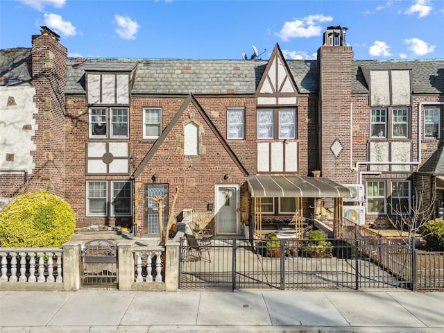 21-25 146th St, Whitestone, NY 11357 - multi unit property with brick siding, a fenced front yard, and a gate