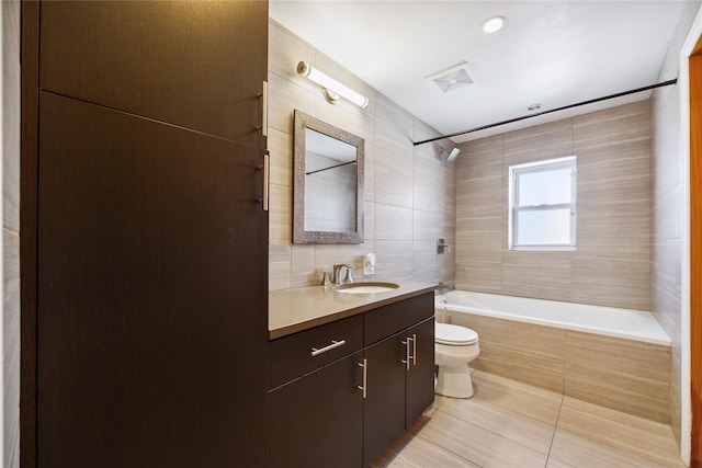 21-25 146th St, Whitestone, NY 11357 - full bathroom with tile patterned floors, vanity, tile walls, shower / tub combination, and toilet