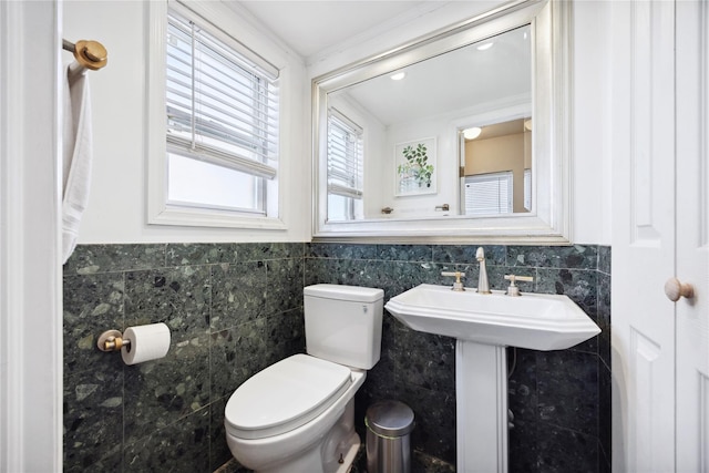 21-25 146th St, Whitestone, NY 11357 - half bath featuring wainscoting, toilet, a sink, and tile walls