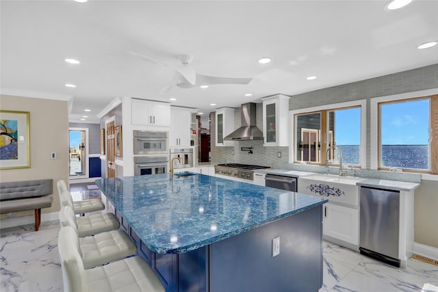 505 E Dr, Copiague, NY 11726 - kitchen featuring wall chimney range hood, appliances with stainless steel finishes, recessed lighting, baseboards, and a sink