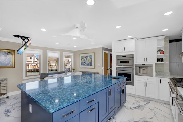 505 E Dr, Copiague, NY 11726 - kitchen with ornamental molding, a sink, a kitchen island with sink, light marble finish flooring, and recessed lighting