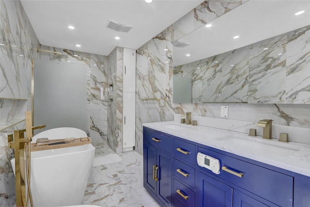 505 E Dr, Copiague, NY 11726 - bathroom featuring double vanity, tile walls, marble tiled floors, a soaking tub, and a marble finish shower