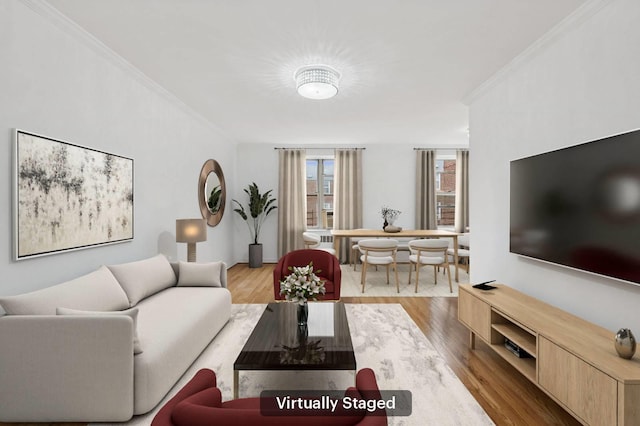 living area with ornamental molding and wood finished floors