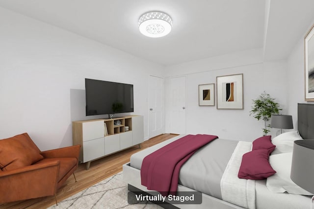 bedroom featuring wood finished floors