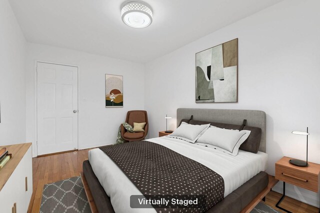 bedroom featuring wood finished floors