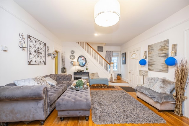 living room featuring stairway and wood finished floors